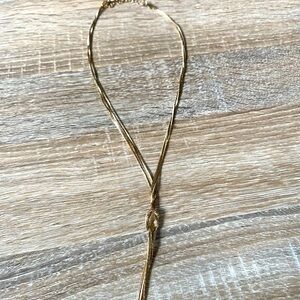 NWOT - Gold Tie Knot Dangly Necklace